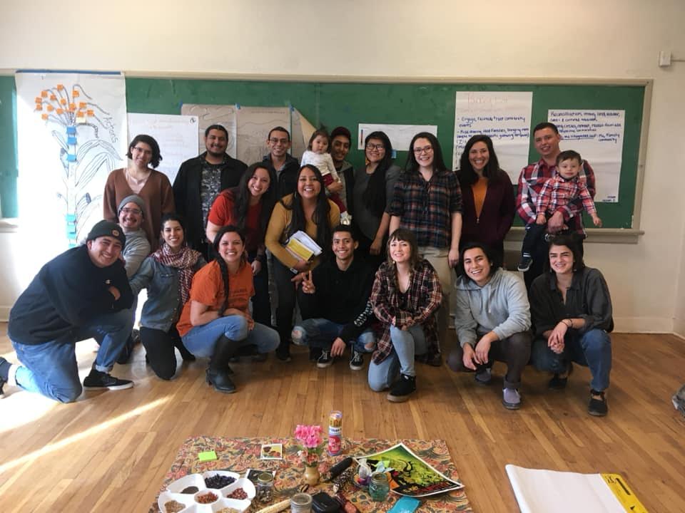 A group of smiling young people at the New Mexico Next Generation Traditional Farmer's Collective.