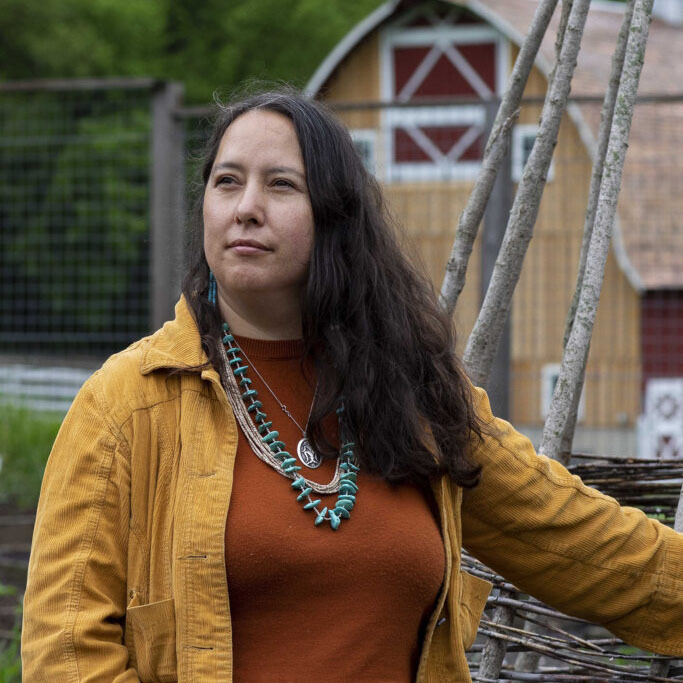 Portrait of Rowen White wearing native necklaces.